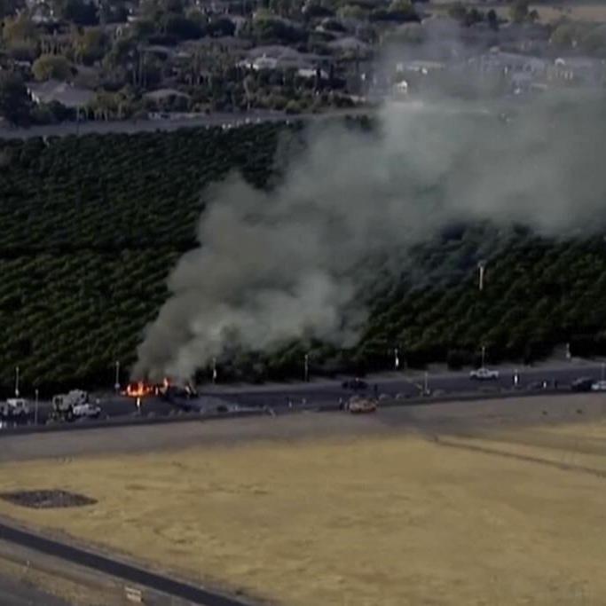 5 people are killed in Arizona when a plane crashes through an airport fence and collides with a car